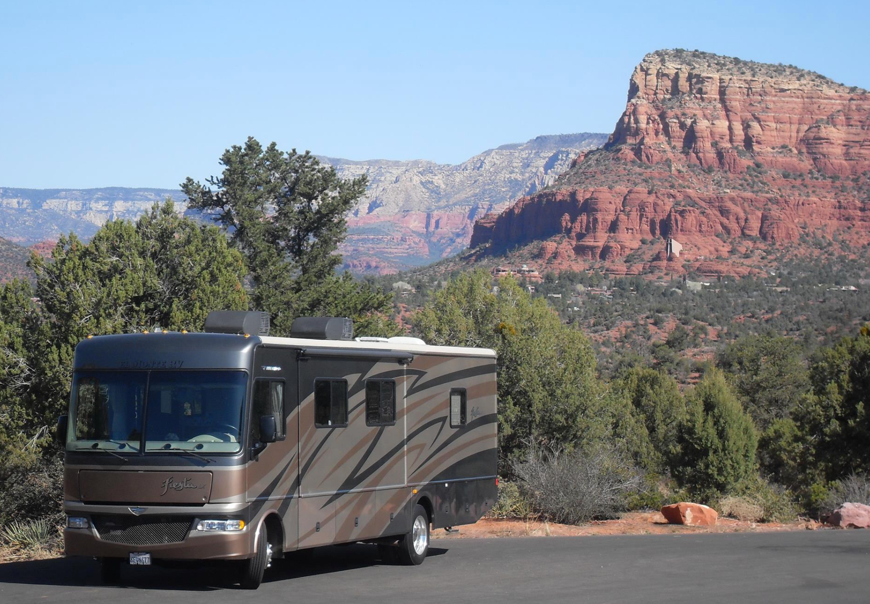 RV hire in the usa woman sat on a rock