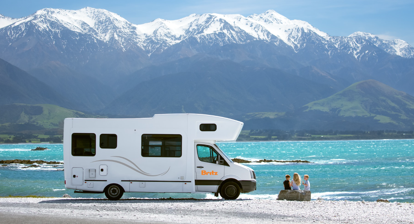 britz campervan on beach new zealand