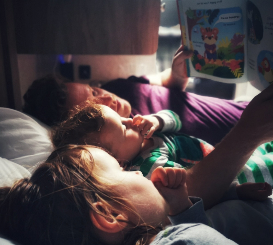kids reading story in Candaream campervan