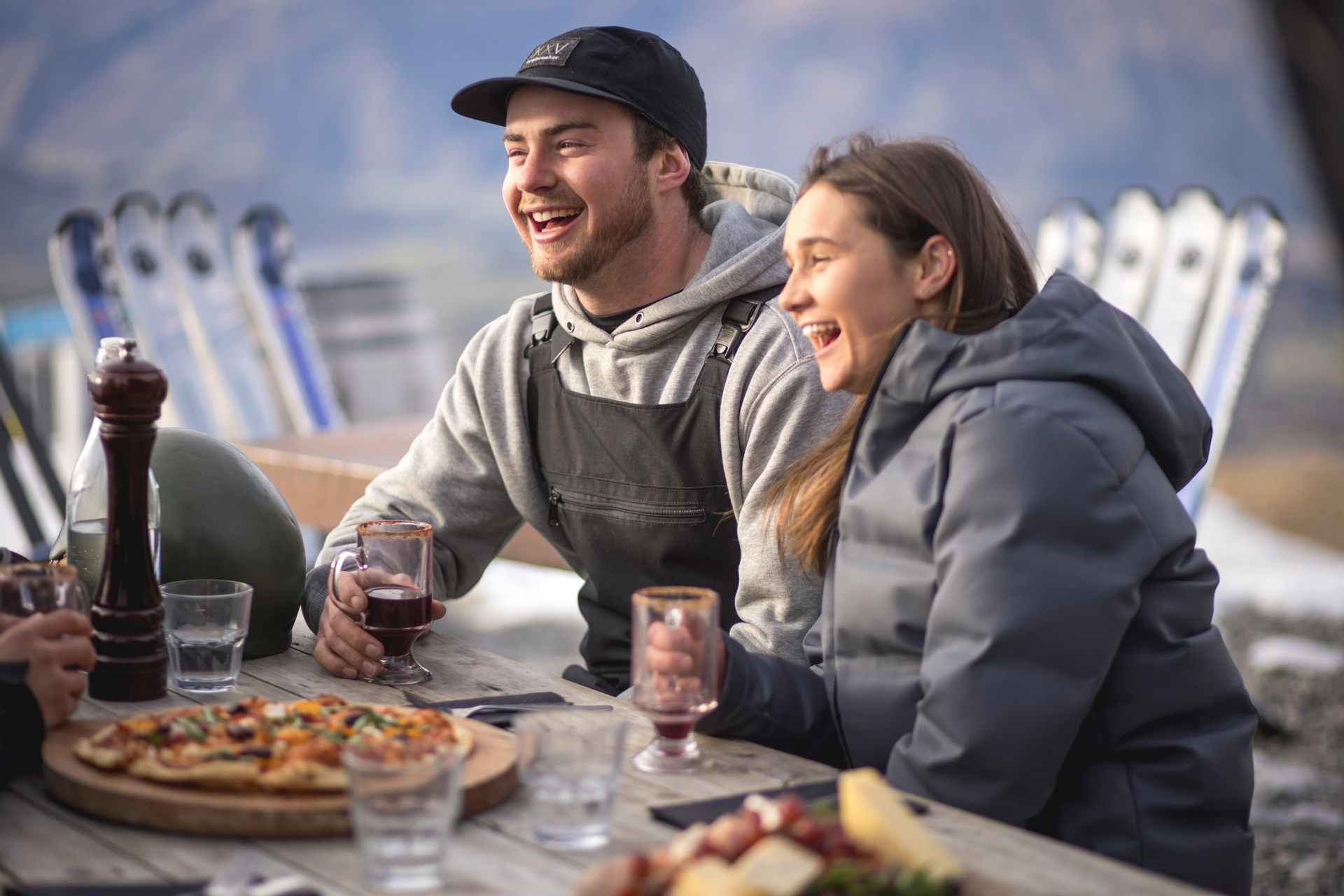 man and woman eating pizza on Australia campervan rental
