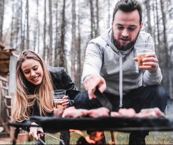man and woman enjoying barbaque