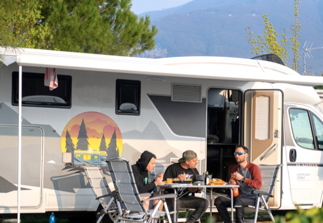 People having food at their motorhome hire in manchester