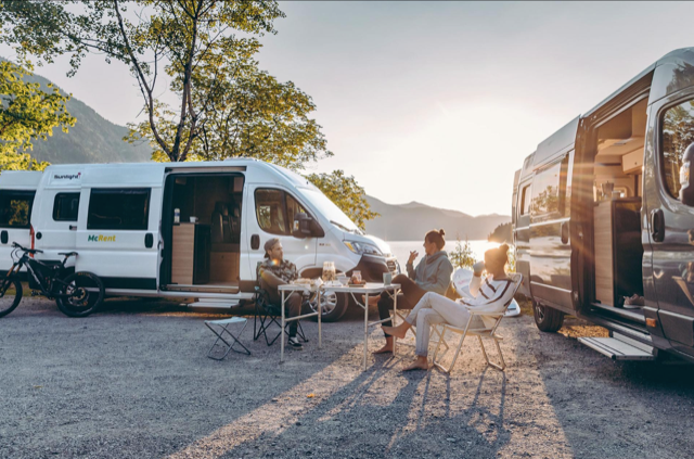 urban luxury mcrent campervan with people sat outside